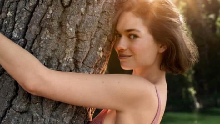 woman hugging tree