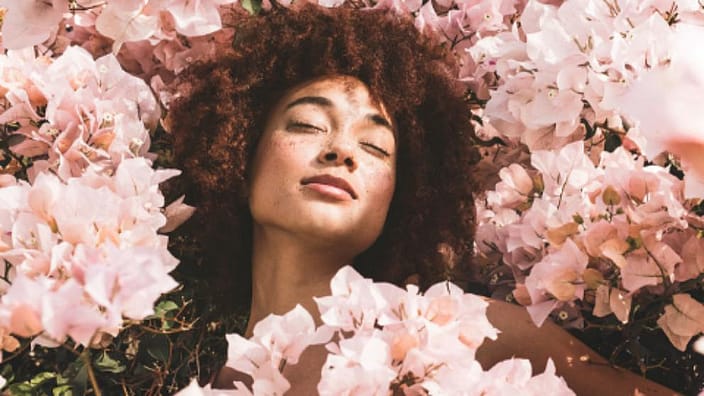 woman lying in flowers